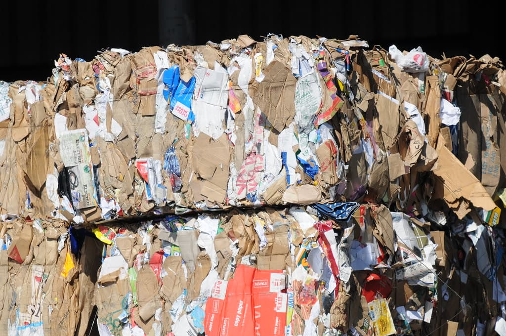 Compressed paper bales at a recycling facility